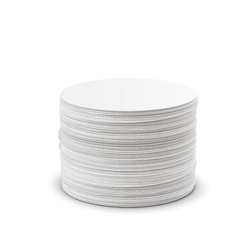 A stack of round white  AreoPress paper filters photographed on a clean white background.